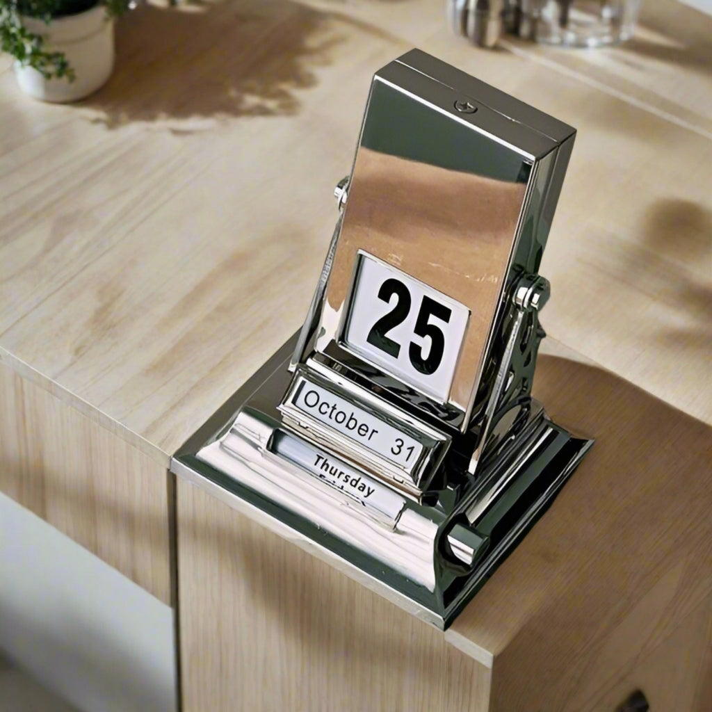 Vintage flip calendar on desk with modern home decor, adding a trendy touch to any space